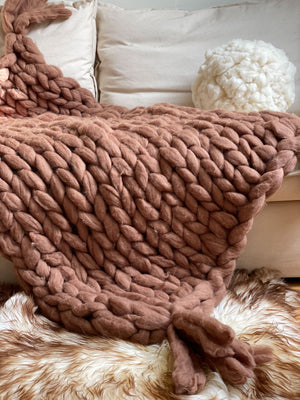 Hooga Blanket in Cozy on a couch