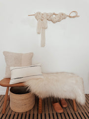Lottie Icelandic Sheepskin on a bench with pillows