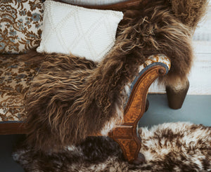 Rue Icelandic Sheepskin on a chaise lounge